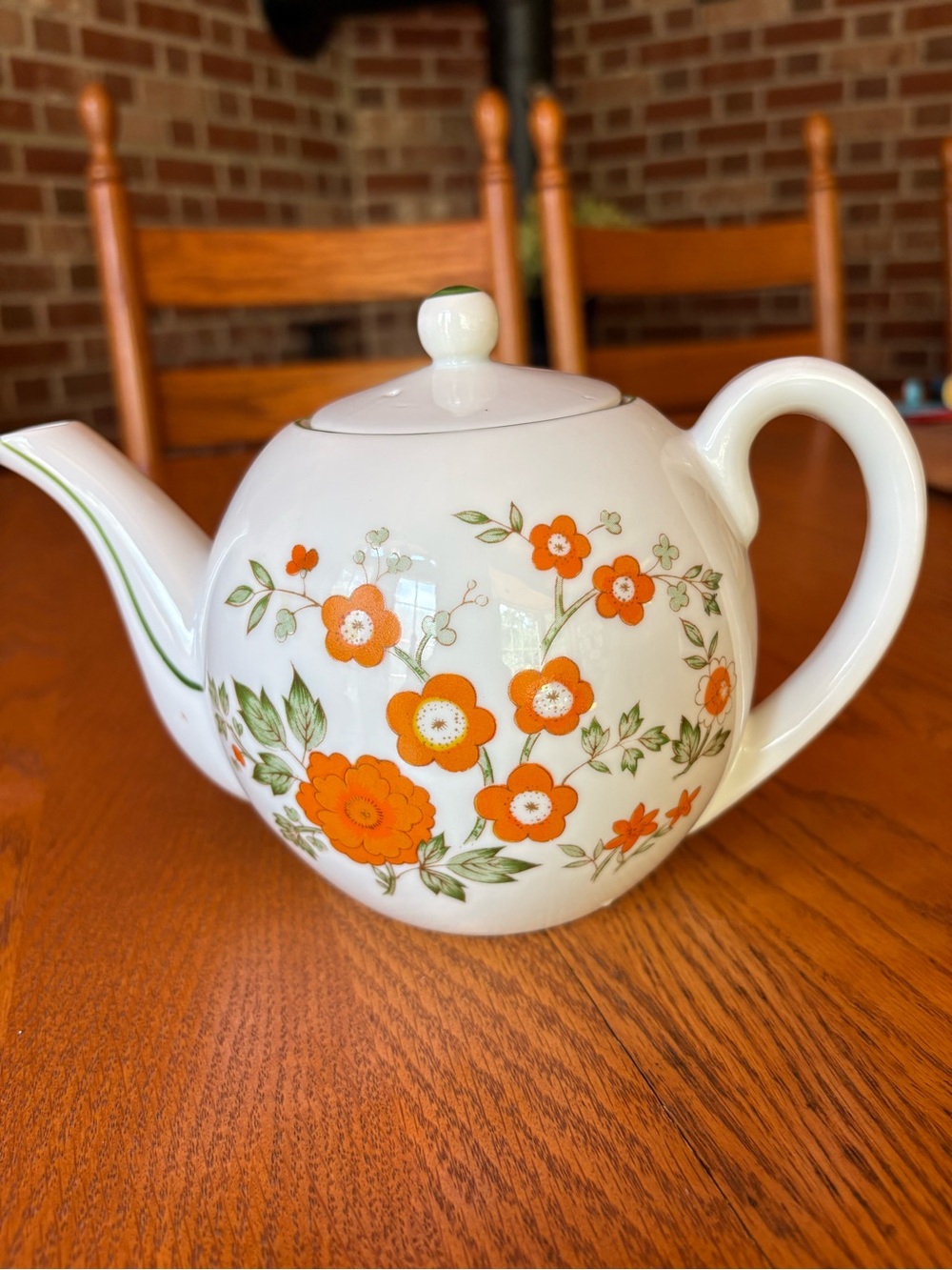 White Ceramic Teapot with Orange Floral Pattern